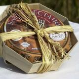 Saint Nectaire cheese in an octagonal wooden container