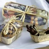 Candied orange peel and chocolates in a Tom Pouce wooden container